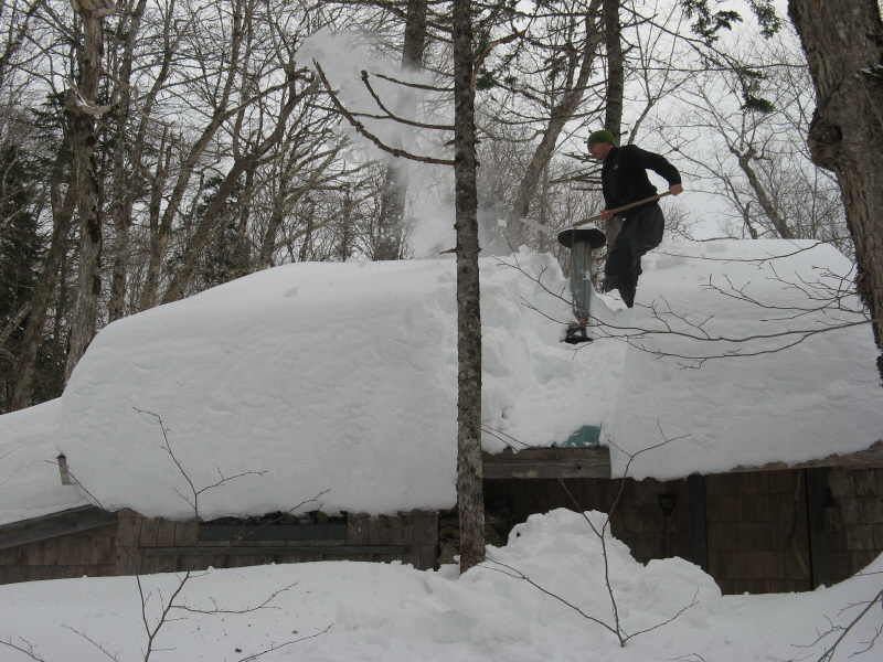 Angelo shovels off the Chalet Roof Angelo shovels off the Chalet Roof